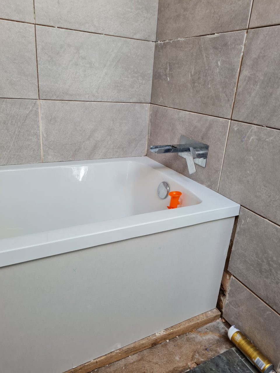 Fitting: the new bath with its waterfall mixer tap installed.