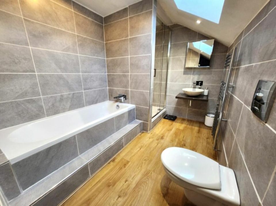 Fitted bathroom in a Blackburn loft conversion by Walsh Property Renovations