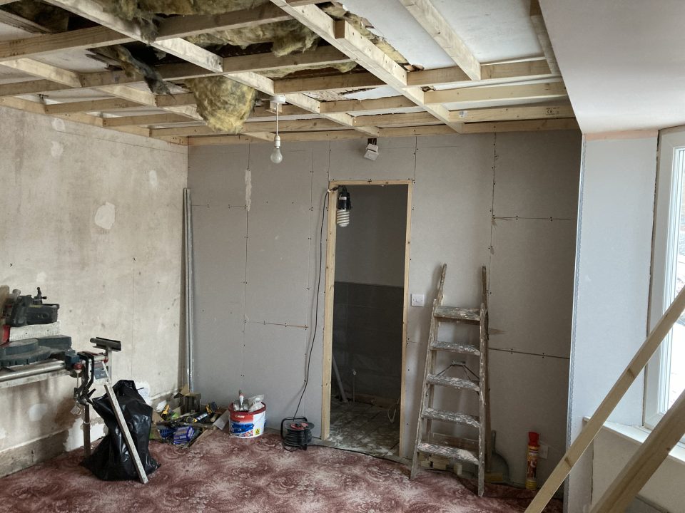 The new en-suite being formed within the existing room — the partition boarded up, no structural changes.