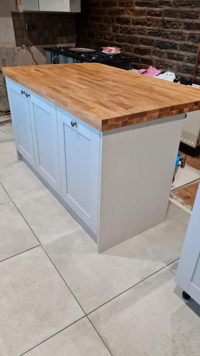 The central island unit taking shape with its solid oak top.