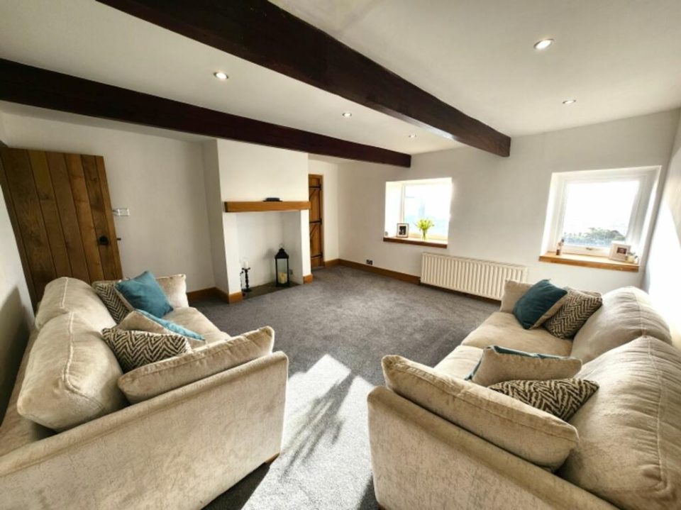 Another view of the finished room, the original beams retained as a feature above the new oak fittings.